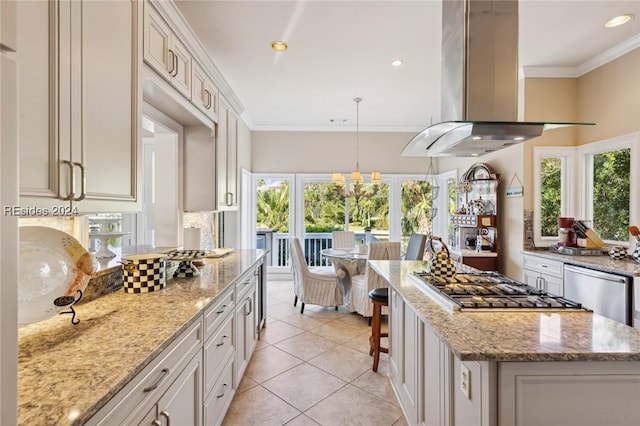 kitchen featuring a kitchen island, island exhaust hood, appliances with stainless steel finishes, and light stone countertops