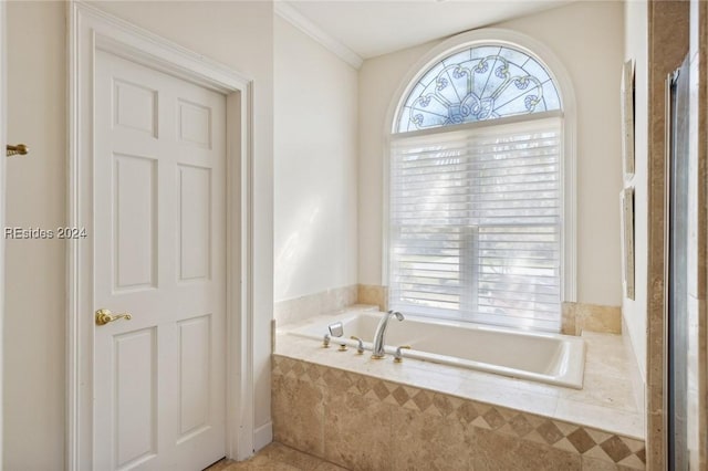 bathroom featuring tiled tub