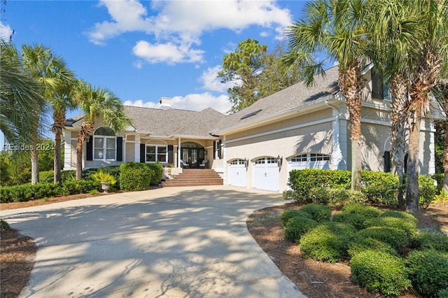 ranch-style home featuring a garage