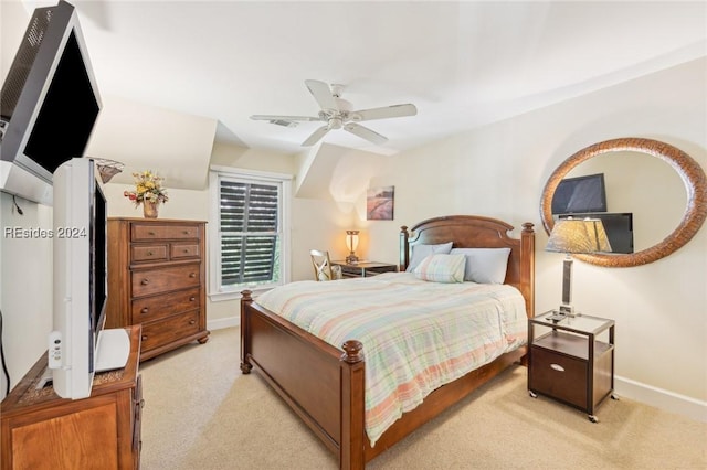 bedroom featuring light carpet and ceiling fan