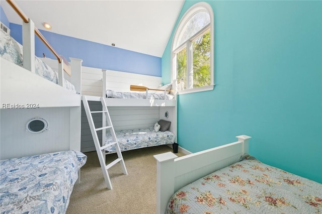 carpeted bedroom with vaulted ceiling