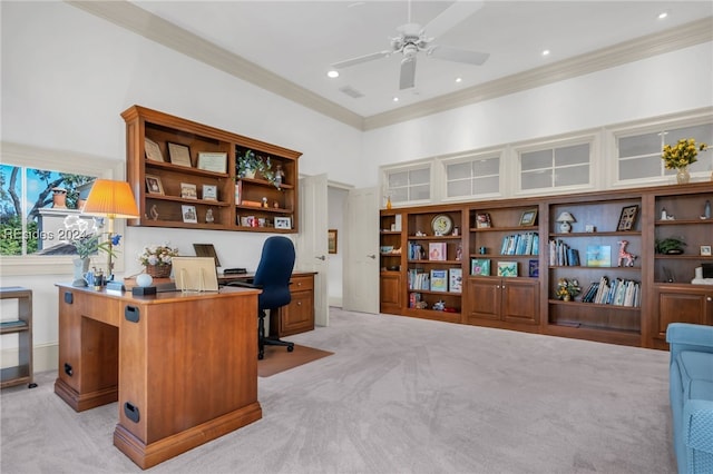 carpeted office space with crown molding and ceiling fan