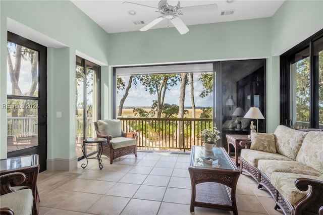 sunroom / solarium with a wealth of natural light and ceiling fan