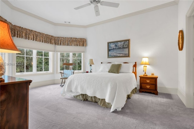 bedroom with crown molding, light carpet, and ceiling fan