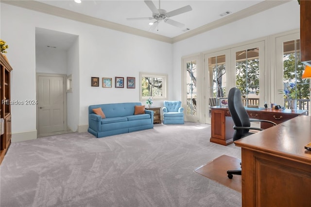 carpeted office with crown molding, ceiling fan, and french doors