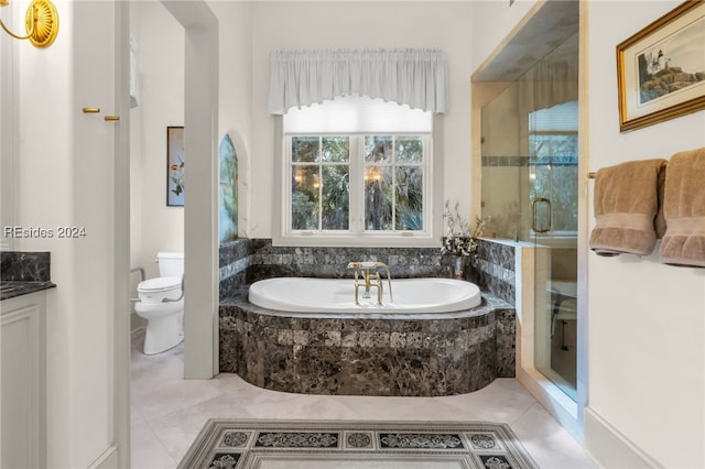 full bathroom with tile patterned floors, vanity, toilet, and separate shower and tub