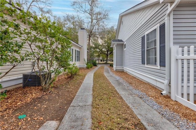 view of property exterior with central AC unit