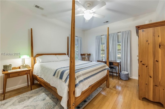 bedroom with light hardwood / wood-style flooring and ceiling fan