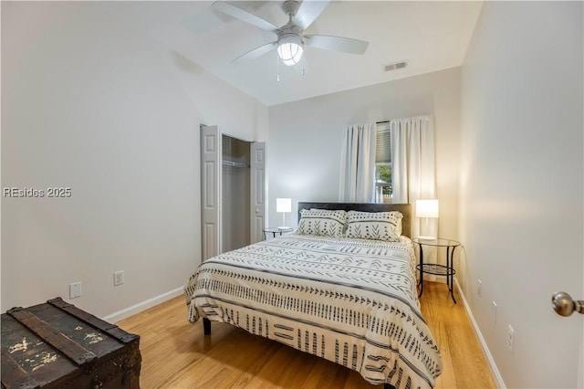 bedroom with hardwood / wood-style floors and ceiling fan