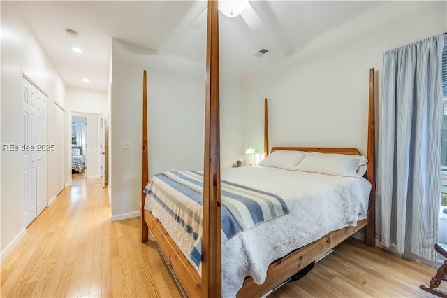 bedroom featuring light hardwood / wood-style floors and ceiling fan