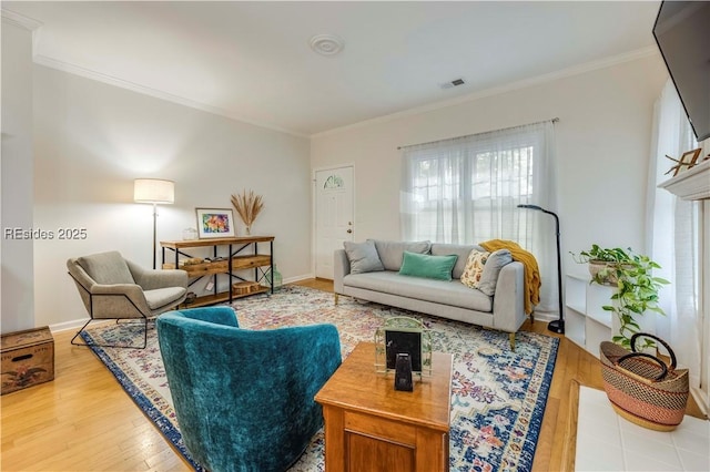 living room with hardwood / wood-style flooring and ornamental molding