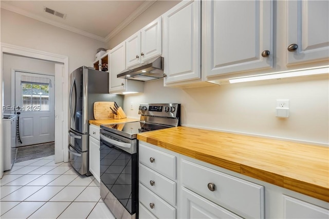 kitchen featuring wood counters, white cabinetry, crown molding, separate washer and dryer, and appliances with stainless steel finishes