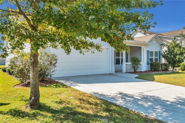 view of front of property featuring a garage and a front yard