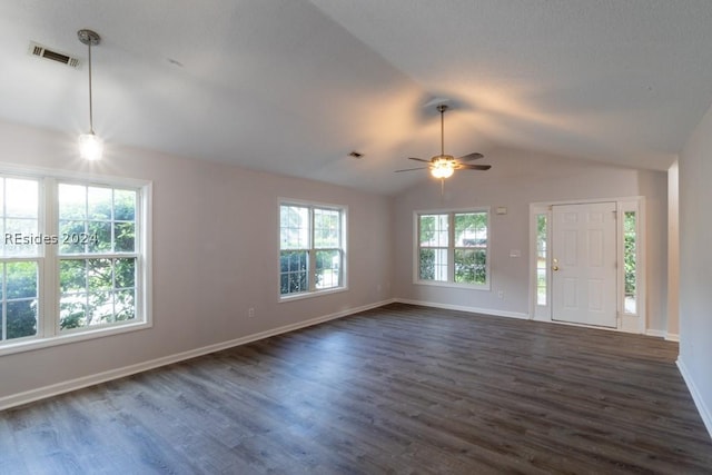 interior space featuring dark wood-type flooring, ceiling fan, and vaulted ceiling