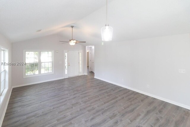 unfurnished living room featuring hardwood / wood-style flooring, lofted ceiling, and ceiling fan