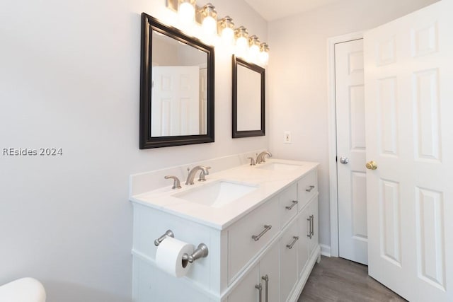 bathroom featuring vanity and wood-type flooring