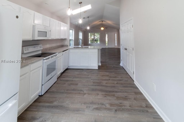 kitchen featuring sink, white cabinets, white appliances, and kitchen peninsula