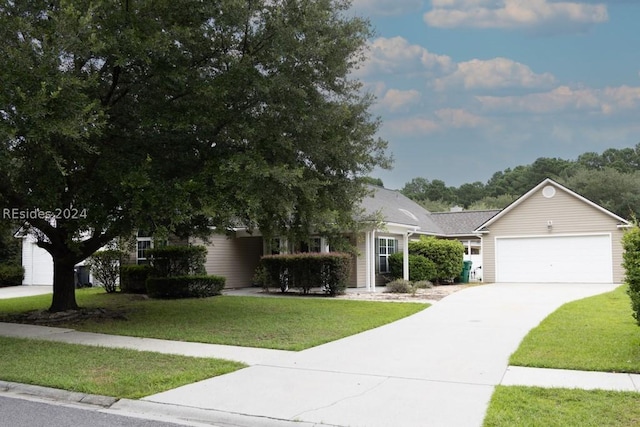 view of front of property with a garage and a front yard