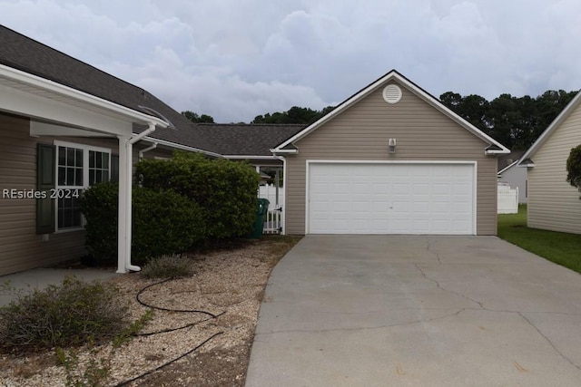 ranch-style home featuring a garage