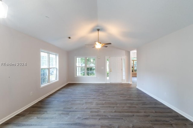 unfurnished living room with ceiling fan, lofted ceiling, and dark hardwood / wood-style flooring