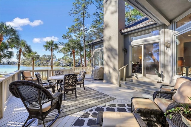 wooden terrace with a water view