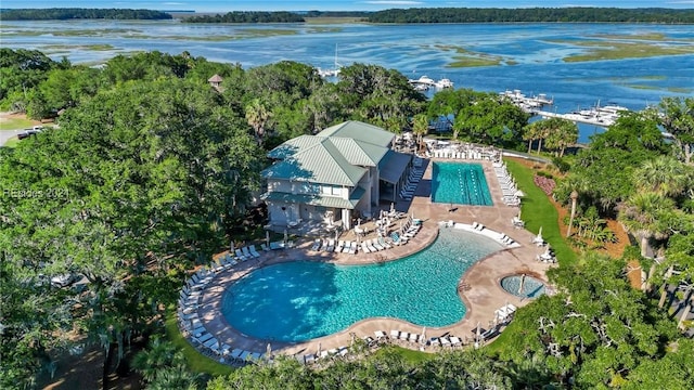 birds eye view of property with a water view