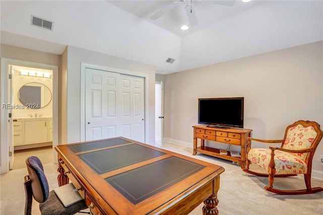 office space with lofted ceiling, light colored carpet, and ceiling fan