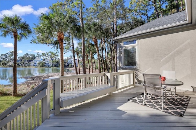 wooden deck featuring a water view