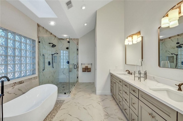 bathroom featuring vanity and separate shower and tub