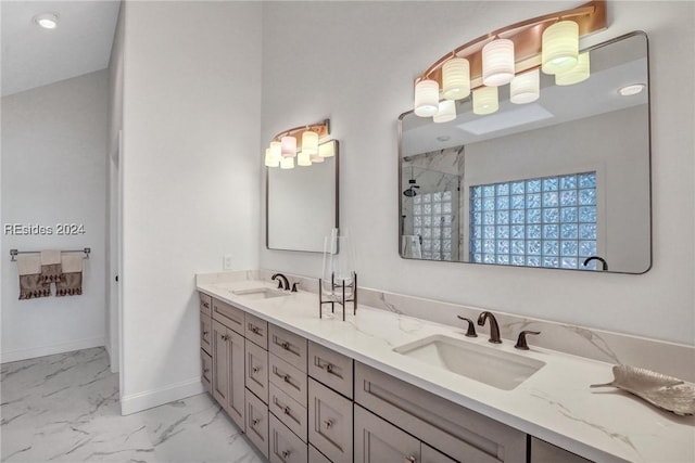 bathroom with vanity and a shower with shower door