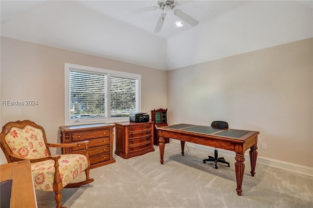 carpeted office space featuring vaulted ceiling and ceiling fan