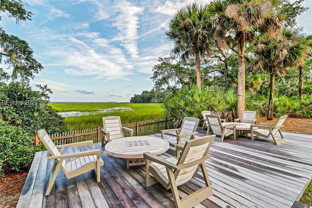 wooden deck featuring a water view