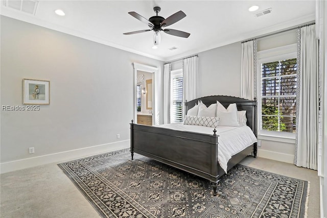 bedroom featuring crown molding, ceiling fan, carpet, and ensuite bath