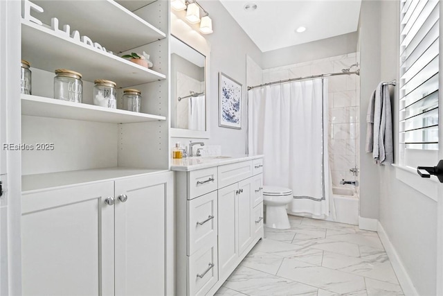 full bathroom featuring shower / tub combo with curtain, vanity, and toilet