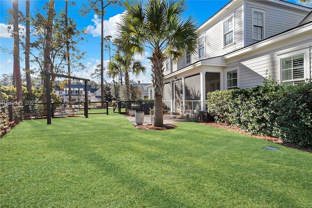 view of yard with a sunroom