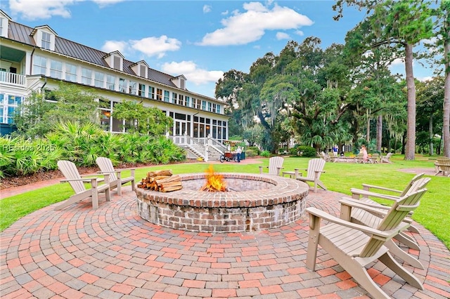 view of patio / terrace with an outdoor fire pit