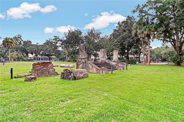 view of home's community with a yard