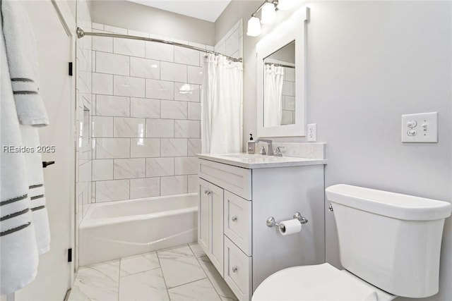 full bathroom with vanity, shower / bath combo with shower curtain, and toilet