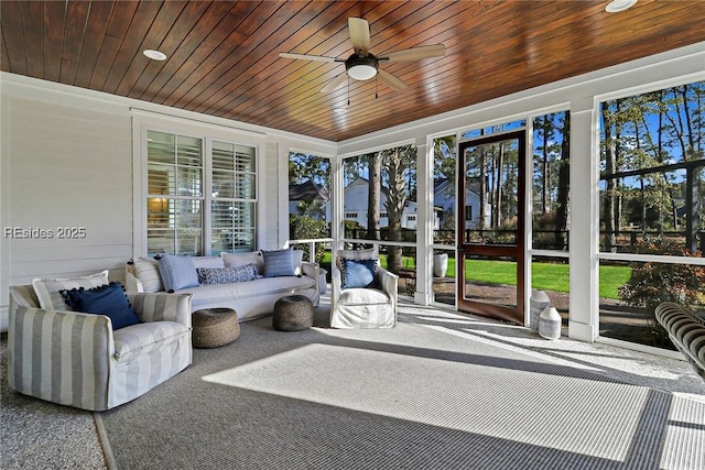 sunroom / solarium with wooden ceiling and ceiling fan