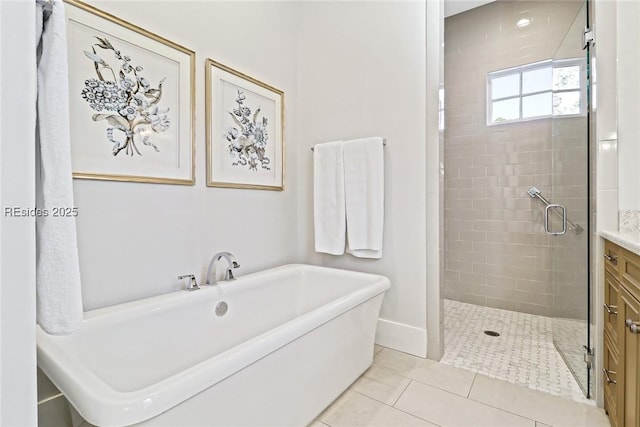 bathroom featuring vanity, tile patterned floors, and independent shower and bath