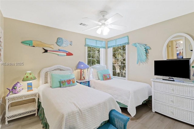 bedroom featuring wood-type flooring and ceiling fan