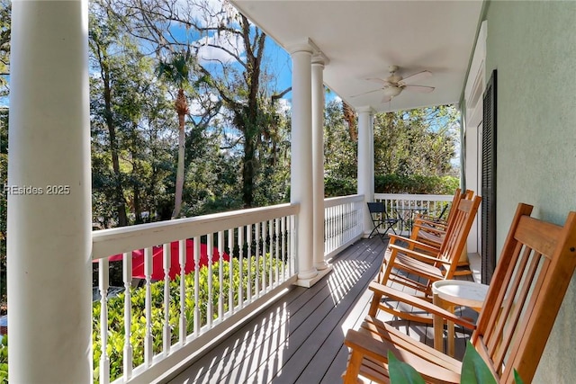 balcony with ceiling fan and a porch