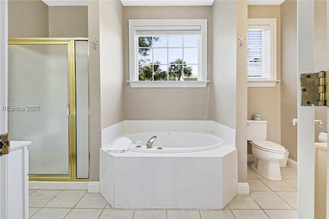 bathroom with tile patterned flooring, shower with separate bathtub, and toilet