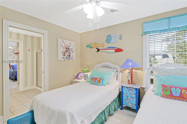 bedroom with light tile patterned floors and ceiling fan