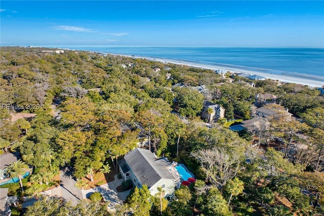 bird's eye view with a water view and a beach view