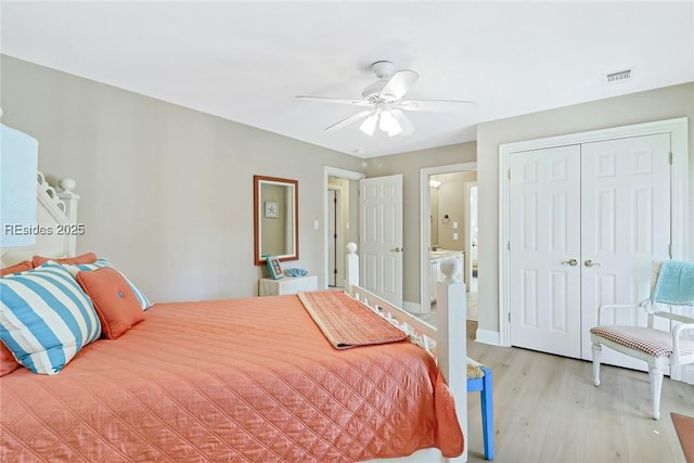 bedroom with ceiling fan, a closet, and light wood-type flooring