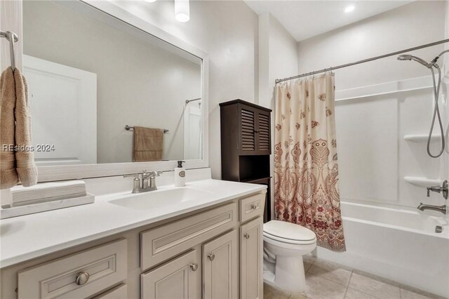 full bathroom featuring vanity, tile patterned flooring, shower / bath combination with curtain, and toilet