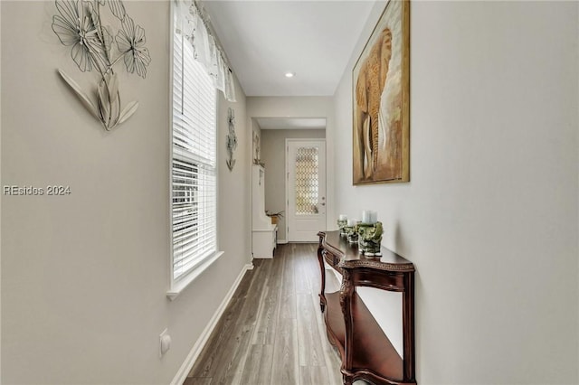 hall with dark hardwood / wood-style floors