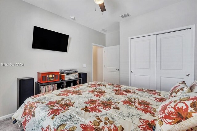 bedroom with carpet floors, a closet, and ceiling fan