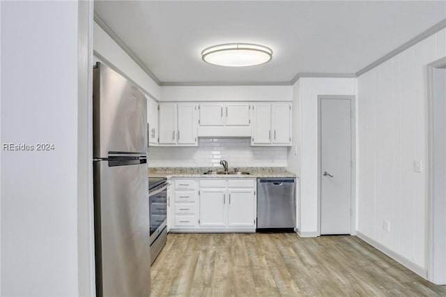 kitchen featuring sink, crown molding, light hardwood / wood-style flooring, appliances with stainless steel finishes, and white cabinets